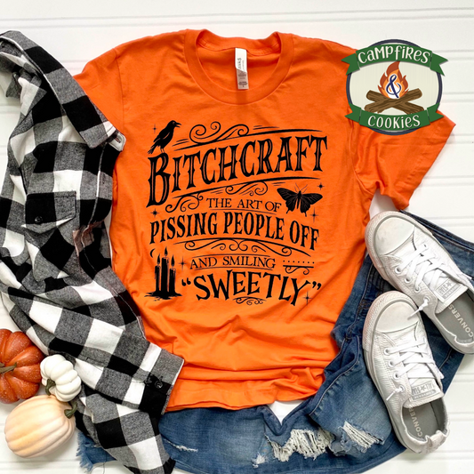 Bitchcraft – The Art of Pissing People Off and Smiling Sweetly Graphic Apparel